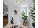 Bright foyer with tile flooring, decor and natural light at 2301 E Yale Ave, Denver, CO 80210