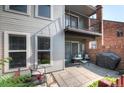 View of the outdoor patio with a grill, furniture, and plants at 1201 Galapago St # 109, Denver, CO 80204