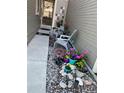Charming home entrance with river rock garden, colorful flowers, and welcoming seating at 4663 S Fraser Ct # C, Aurora, CO 80015