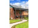 Inviting front porch with seating, creating a welcoming entrance at 2120 N Poplar St, Denver, CO 80207