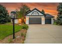 Charming home with a three-car garage and an inviting driveway at 44 Spyglass Dr, Littleton, CO 80123