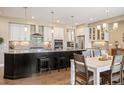 Modern kitchen featuring granite countertops, stainless steel appliances, and a center island at 350 Andromeda Ln, Castle Rock, CO 80108