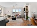 Spacious living room featuring a fireplace and hardwood floors at 1440 Little Raven St # 204, Denver, CO 80202