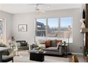 Comfortable living room with gray sofa and city views at 1440 Little Raven St # 204, Denver, CO 80202