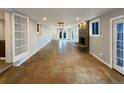 Spacious living area featuring hardwood floors, recessed lighting and a stone fireplace at 6757 Lee St, Arvada, CO 80004