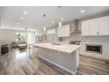 Modern kitchen featuring a spacious island, stainless steel appliances, and a bright, open layout at 8948 Delacorte St, Highlands Ranch, CO 80129