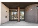 Inviting building entrance with textured brick, modern fixtures, and clear signage for '603 FACP' at 603 Inca St # 432, Denver, CO 80204