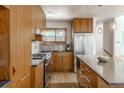 Modern kitchen features stainless steel appliances, an island, hardwood floors and lots of cabinet space at 79 Huron Ct, Boulder, CO 80303