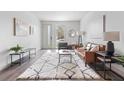 Modern living room showcasing a cozy seating area, a stylish rug, and an open layout for easy living at 1308 Stuart St, Denver, CO 80204