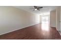 Spacious living room with gleaming hardwood floors and a ceiling fan for added comfort at 19038 E Girard Ave, Aurora, CO 80013