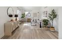 Sunlit living room featuring a neutral color palette, wood floors, and modern furnishings at 3251 N Madison St, Denver, CO 80205