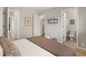 Bright bedroom with an ensuite bathroom and closet, showcasing a comfortable and functional space at 3251 N Madison St, Denver, CO 80205