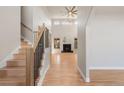 Spacious living room with high ceilings, hardwood floors, and a cozy fireplace as a focal point at 1313 Jade Ln, Longmont, CO 80504