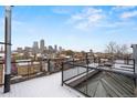 Outdoor roof deck offers stunning views of the city skyline and ample space for entertaining at 1515 N Ogden St # 7, Denver, CO 80218
