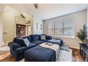 Cozy living room featuring a large sectional sofa, perfect for relaxation at 1897 S Buchanan Cir, Aurora, CO 80018