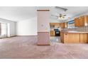 Open floor plan featuring a spacious living room, a functional kitchen and a unique design at 835 S Geneva St, Aurora, CO 80247