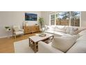 Cozy living room filled with natural light, showcasing stylish furnishings and a serene atmosphere at 11886 E Fair Ave, Greenwood Village, CO 80111