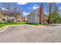 Charming townhome with a brick chimney, complemented by a lush lawn and ample parking at 1662 S Blackhawk Way # A, Aurora, CO 80012