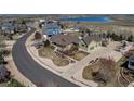 Beautiful aerial view of a home, showcasing the landscaping, three car garage, lawn, and neighborhood at 3545 Cottonwood Cir, Longmont, CO 80504