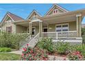 Welcoming front porch with seating and mature landscaping, enhancing the curb appeal at 3545 Cottonwood Cir, Longmont, CO 80504