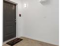 Clean entryway featuring a welcome mat and a neutral color palette for a modern, inviting space at 8475 E 36Th Ave # 131, Denver, CO 80238