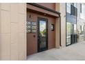 Modern building exterior with multiple units, visible unit numbers, and easy access entrance at 8475 E 36Th Ave # 131, Denver, CO 80238