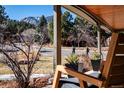 Scenic view from the covered front porch showcasing the beautiful neighborhood and mountain backdrop at 1740 Bear Mountain Dr, Boulder, CO 80305