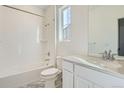 Bathroom featuring tile flooring, a shower-tub, toilet, and vanity with countertop at 2088 S Haleyville Way, Aurora, CO 80018