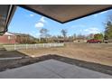 Unfinished backyard displaying the home's lot lines and white picket fence at 9950 W 17Th Ave, Lakewood, CO 80215