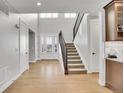 Bright and spacious entryway with hardwood floors and modern staircase at 359 Castlemaine Ct, Castle Rock, CO 80104