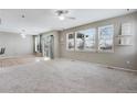 Spacious living room with hardwood floors and lots of natural light at 23802 E 2Nd Dr, Aurora, CO 80018