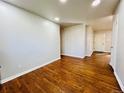 Bright living room featuring gleaming hardwood floors and neutral paint at 2027 S Newton St, Denver, CO 80219