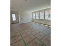 Bright living room with lots of windows and plenty of space for furniture at 22 Waterford St, Erie, CO 80516
