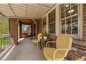 Relaxing covered front porch with seating, perfect for enjoying the outdoors in comfort and style at 1840 S Grant St, Denver, CO 80210