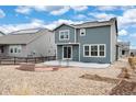 Spacious backyard featuring a patio, fire pit, and low-maintenance landscaping at 12777 Clearview St, Firestone, CO 80504