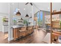 Spacious kitchen with a large island, pendant lighting, and modern finishes creates an inviting atmosphere at 7888 S Magnolia Way, Centennial, CO 80112