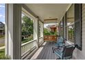 Inviting front porch with a swing, chairs, and a view of the neighborhood at 3354 Wabash St, Denver, CO 80238