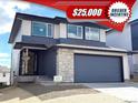 Beautiful home featuring a two-car garage, stylish stone accents, and a covered entry at 4888 Noris Ave, Morrison, CO 80465
