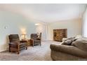 Spacious living room featuring carpet, a cabinet, and comfortable seating at 13123 Spica Dr, Lone Tree, CO 80124