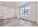 Inviting open living area with large windows that allows ample natural light at 1974 S Haleyville Way, Aurora, CO 80018