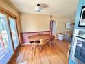 Bright dining area with hardwood floors, adjacent to large sliding doors, offering indoor-outdoor living at 4060 Shaw Blvd, Westminster, CO 80031