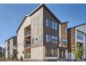 Multi-story townhome featuring private balconies and a stylish, contemporary design at 1764 Peak Loop, Broomfield, CO 80023