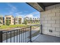 Exterior view showing a common green area, benches, and walking path at 1764 Peak Loop, Broomfield, CO 80023