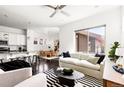 Open-concept living area with lots of natural light, modern decor, and seamless flow at 6654 Pecos St, Denver, CO 80221