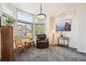 Bright living room with large windows, comfortable seating, and stylish decor at 22560 E Rowland Dr, Aurora, CO 80016
