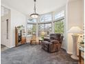 Inviting living room with large windows and stylish decor, ideal for relaxing and entertaining at 22560 E Rowland Dr, Aurora, CO 80016