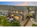 Spacious backyard features a large deck, mature trees, and privacy fencing at 7734 Blue Water Dr, Castle Rock, CO 80108