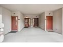 A common entryway featuring multiple entrance doors, each leading to different units within the building at 10725 Eliot Cir # 102, Denver, CO 80234