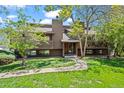Inviting townhome with well-manicured lawn, mature trees, and private entrance at 2630 Juniper Ave # 37-5, Boulder, CO 80304