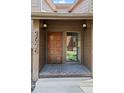 Close-up of the front door with brick landing, and visible address at 2630 Juniper Ave # 37-5, Boulder, CO 80304